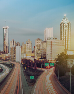 Skyscrapers and the blue sky, with fast car movement